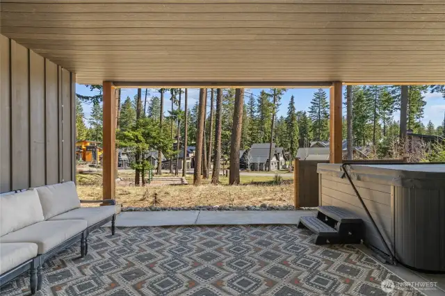 Downstairs covered space with hot tub