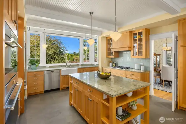 Wow! The kitchen is over the top! Granite counters, shaker style cabinets and tile floors.