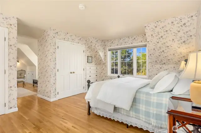 Primary bedroom ensuite plus an additional sitting room features big Olympic views, hard wood floors and beautiful built in shelves.
