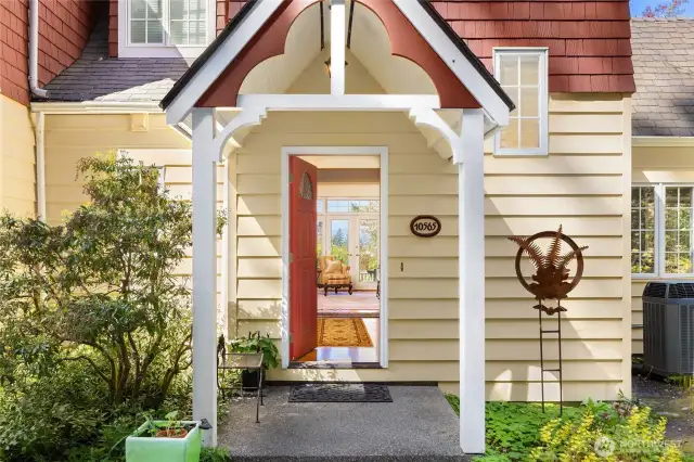 The covered front porch invites you in to a grand foyer where you immediately see the quality of finish and the light streaming in from all sides.