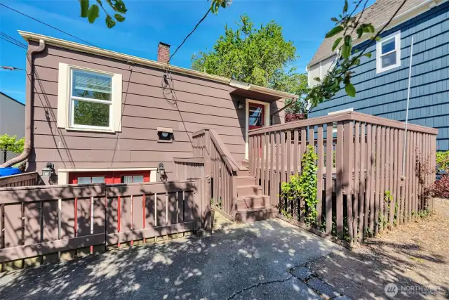Back yard with deck and access to lower level