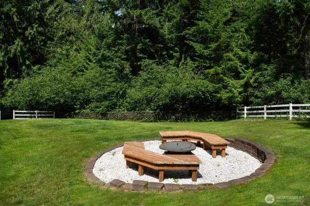 This custom fire pit area offers a peaceful retreat for cozy nights and casual entertaining.