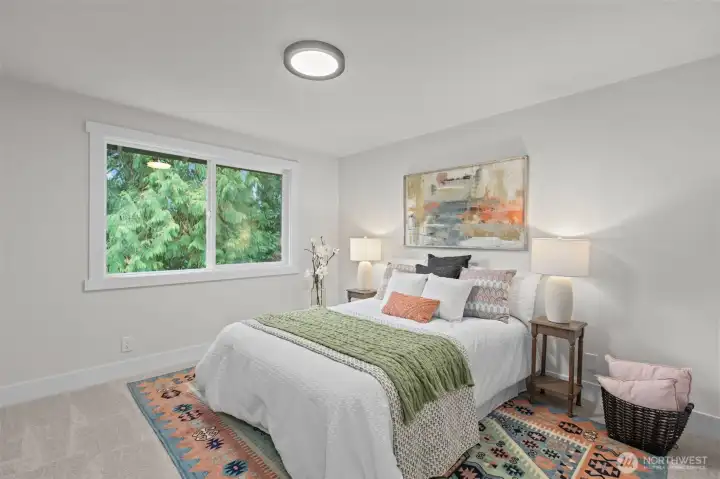 Bedroom number four upstairs with more woodland views.