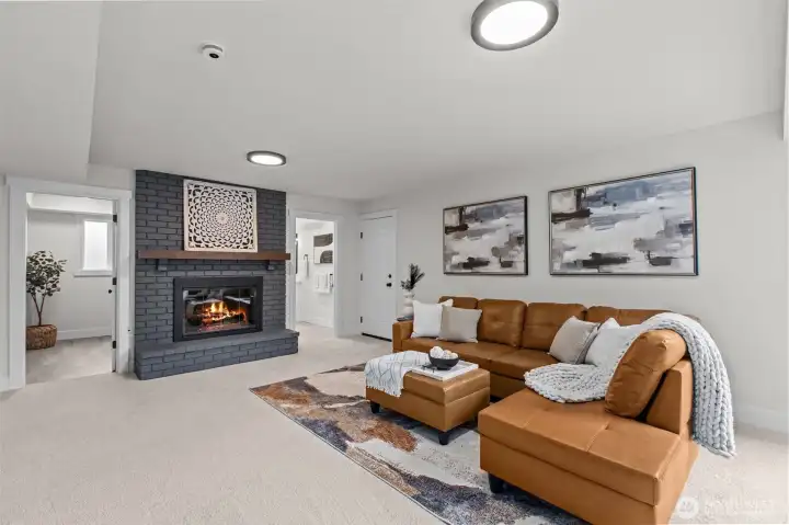 Another fireplace, utility room, and 3/4 bathroom on this level make the space extremely usable.