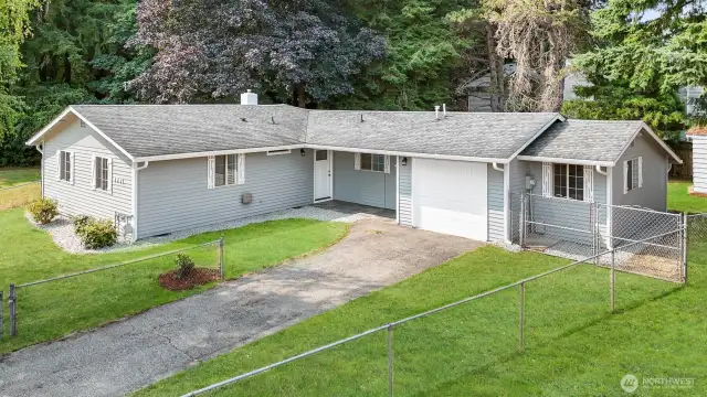 Cute and cozy three bedroom rambler, fully remodeled and ready for you to move in! Green grass has been digitally altered in photo.