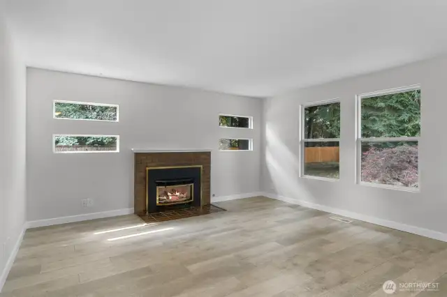 Extra windows allow for natural lighting to flood the home. Brick wrapped gas fireplace provides winter warmth and ambiance.