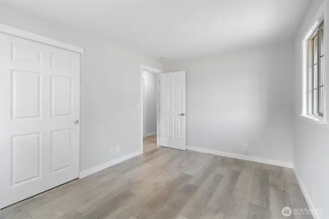 Another view of the Primary Bedroom showing the closet with new six panel door.