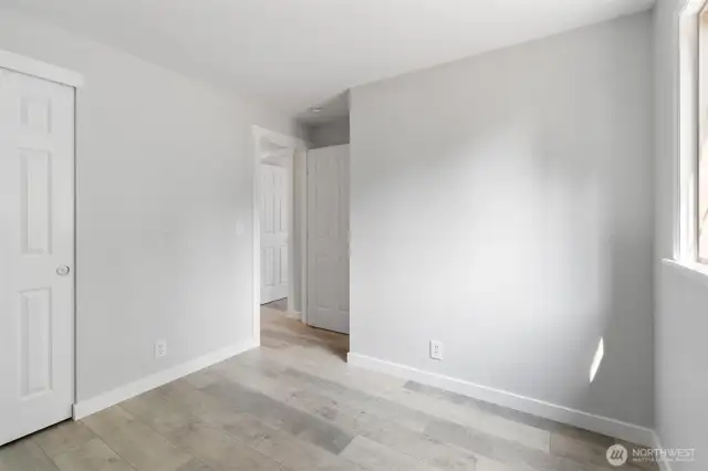 One of two guest bedrooms, each with multiple electrical outlets.