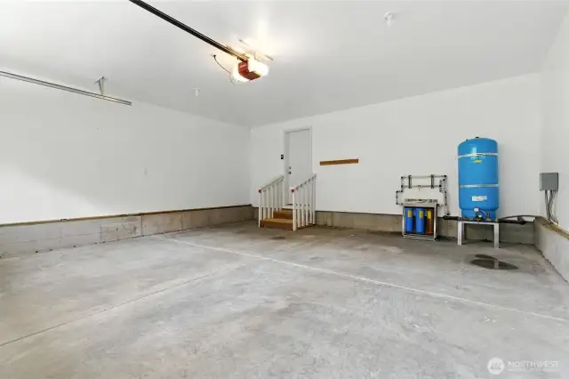 Large clean garage. Water filtration system in blue.
