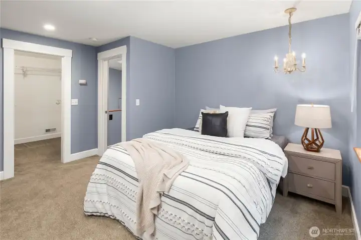 Upper-level 5th of 5 bedrooms with walk-in closet.