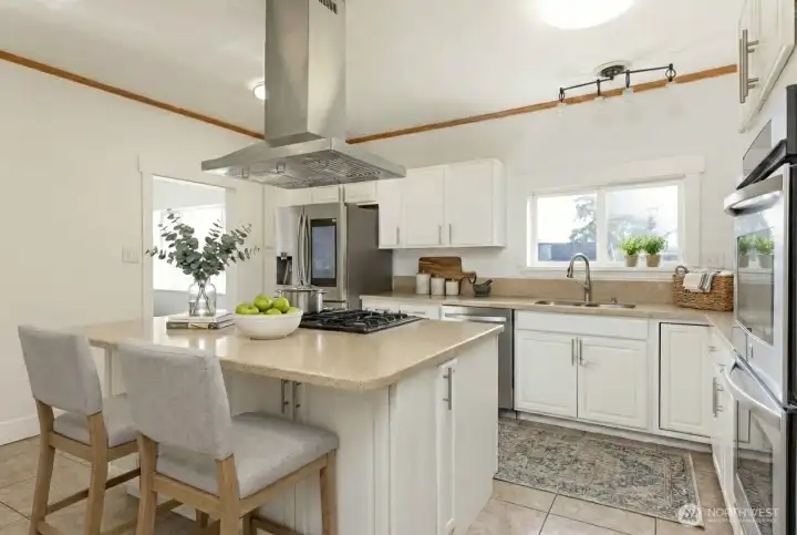 Large island and tons of storage! digitally staged