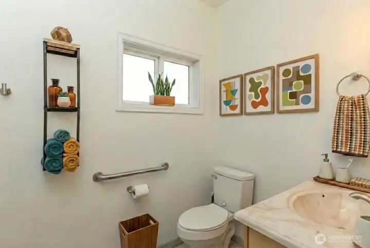 Full bath on main level, digitally staged.