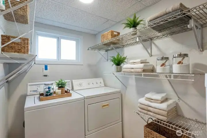 Laundry room comes with washer and dryer. Digitally staged