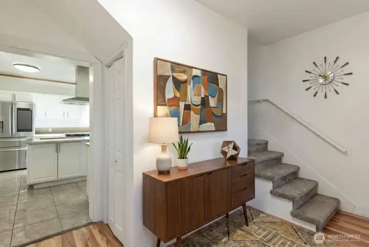 Hallway off kitchen - stairs to second floor. Digitally staged.