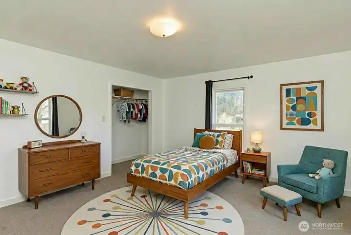 Bedroom #2 of 4 rooms on second floor. Digitally staged.