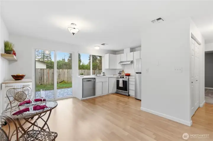 Extra space in this kitchen area. Glass slider leads to a nice patio and fenced yard beyond.