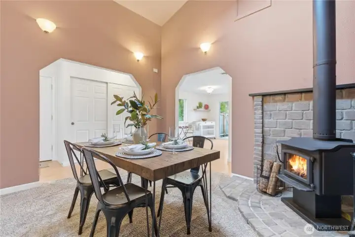 Formal dining room enjoys a cozy wood fireplace,