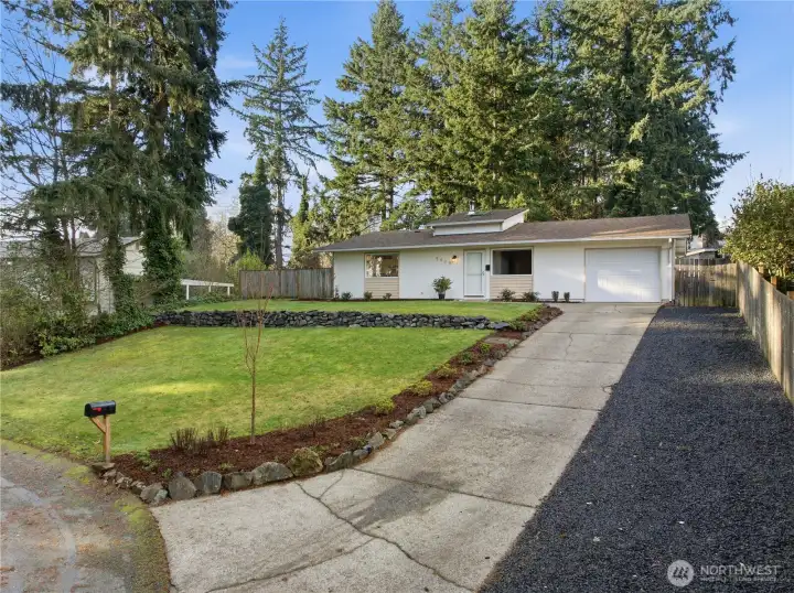 Nice long driveway with extra parking in the new gravel area.