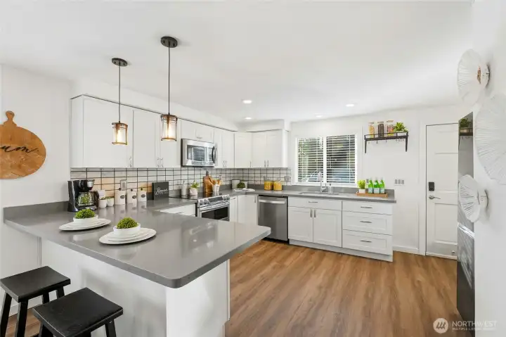 Stainless steel appliances and double ovens make hosting a breeze.