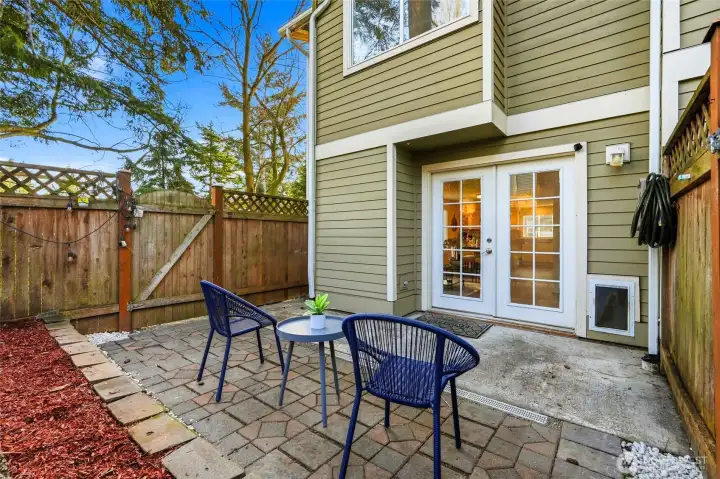 Perfect for morning coffee, pets, container gardening, or evening gatherings.  French drain adds function to this stylish outdoor space.