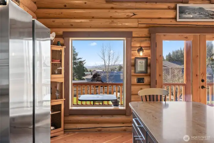 Here is a view from the kitchen, you can always see the beauty outside from anywhere you are. The glass doors allows for more natural light and view opportunities.