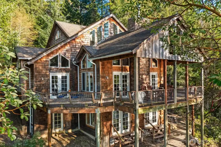 View from west shows finished 2 upper floors and an unfinished basement.