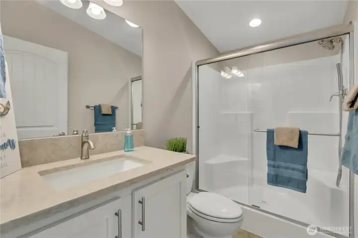 3/4 bath in the hallway with large walk-in shower