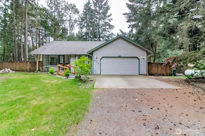 Front of home with plenty of parking