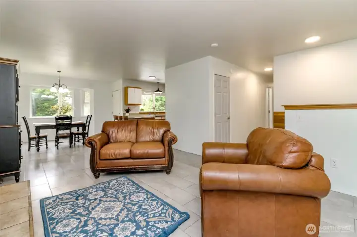 Living room open to dining and kitchen