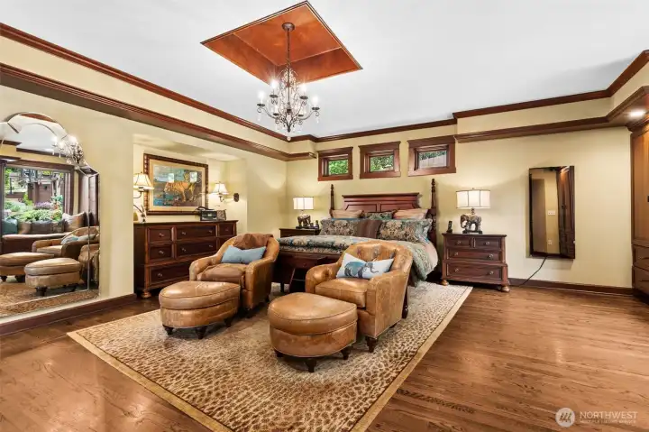Expansive Primary Suite with double-sided fireplace, private balcony, spa, sauna, jetted tub, heated bathroom floors, 5-piece en-suite