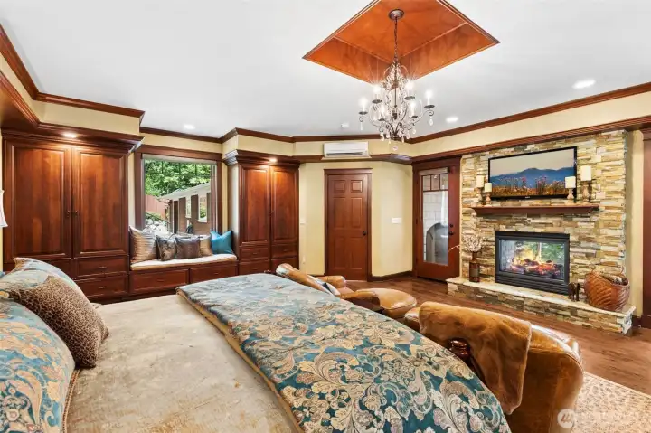 Expansive Primary Suite with double-sided fireplace, private balcony, spa, sauna, jetted tub, heated bathroom floors, 5-piece en-suite