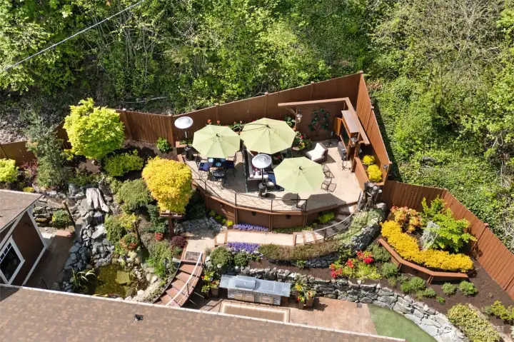 Aerial View of the immaculate, landscaped, and feature-packed outdoor space.