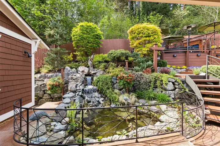 Immaculate, landscaped, feature-packed outdoor space including coy pond, outdoor movie theatre, BBQ area, and more.