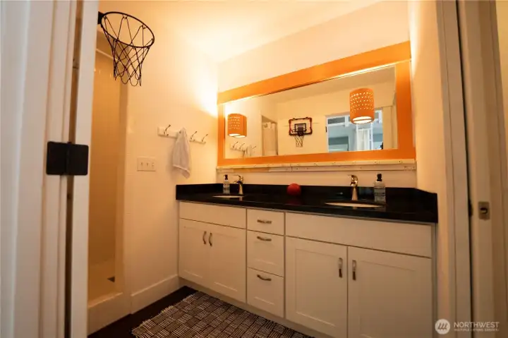 En suite bathroom to bunk room.