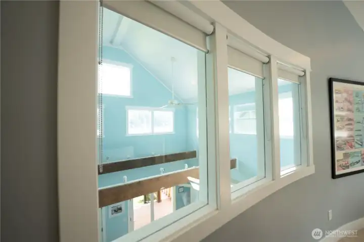 Third bedroom overlooks living room and lake.