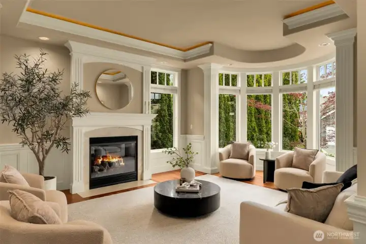 The thoughtfully designed main level features formal dining and sitting rooms, a gourmet kitchen, where casual living and dining spaces flow seamlessly to a private outdoor entertaining patio surrounded by nature's beauty.