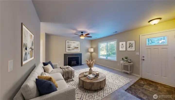 Bright family room featuring a cozy wooden fireplace, large window for abundant natural light, and a spacious layout perfect for entertaining. This photo is virtually staged.