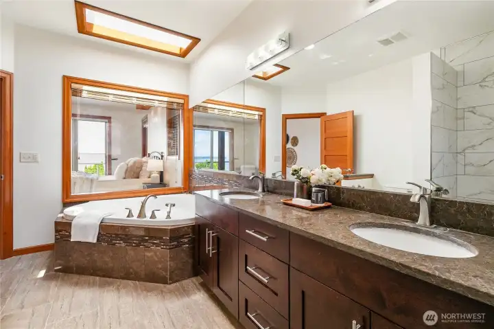 Primary bathroom with soaking tub and double vanity Primary bathroom with soaking tub and double vanity