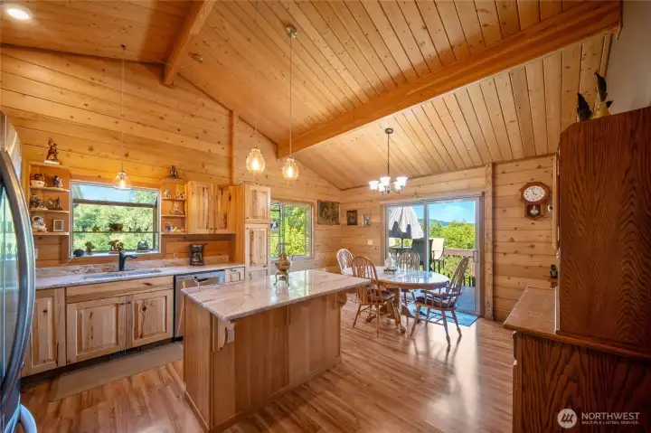 Eat in vaulted kitchen with dining area overlooking deck and views Eat in vaulted kitchen with dining area overlooking deck and views
