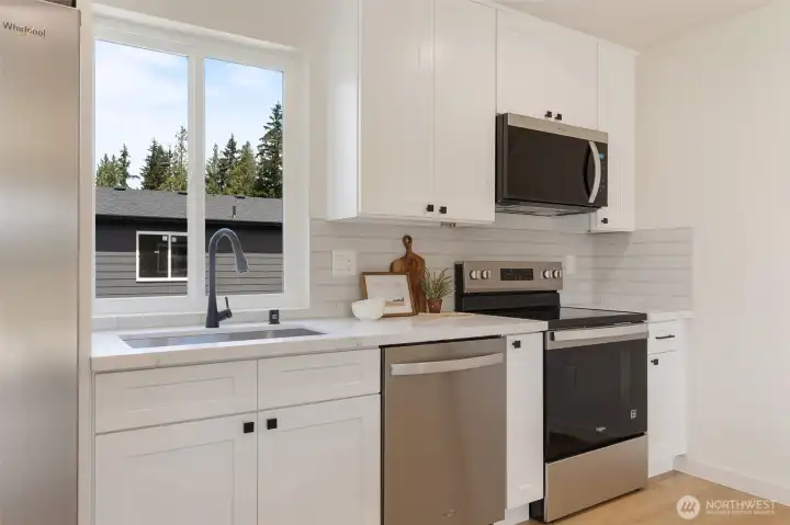 Photo for Reference Only. Kitchen has quartz countertop and stainless appliances. Photo for Reference Only. Kitchen has quartz countertop and stainless appliances.