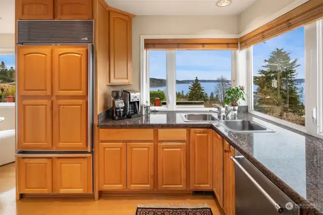 Solid surface counters and a Kitchenaid dishwasher (new in 2023). How about a view that almost makes washing dishes enjoyable?