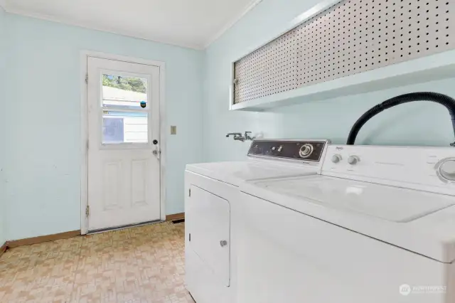 Mudroom with washer/ dryer & access to the back yard