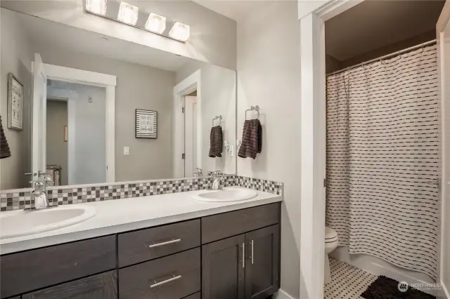 Full hall bathroom with dual sinks & separate shower