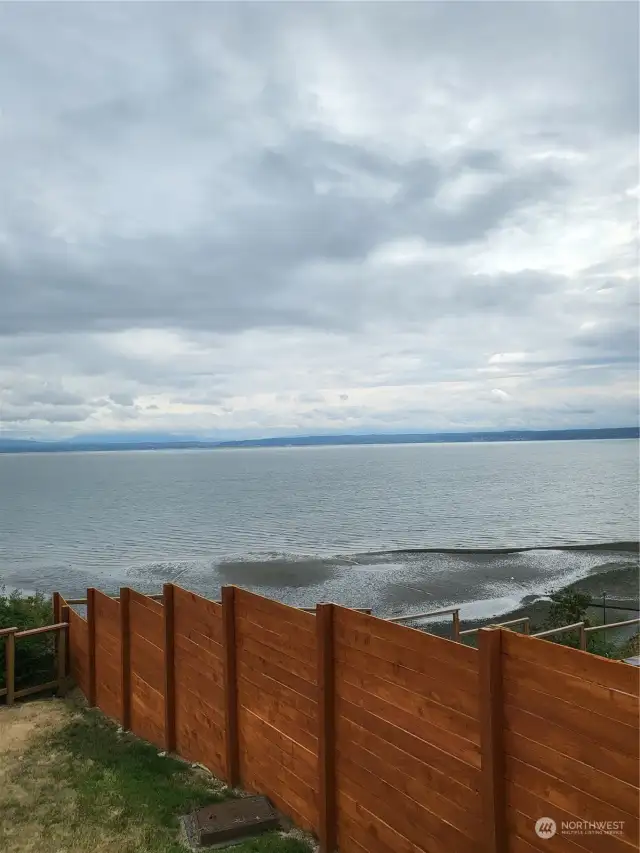 view of water from street over neighbors property