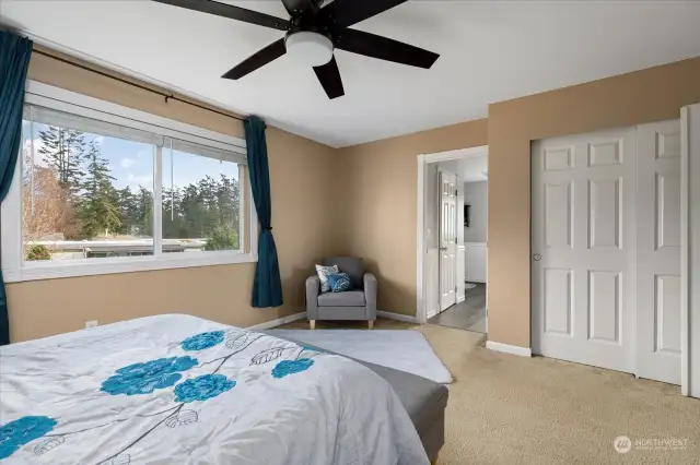 Primary bedroom has ample storage and a beautiful ensuite. Linen closet is shown on right side of picture.