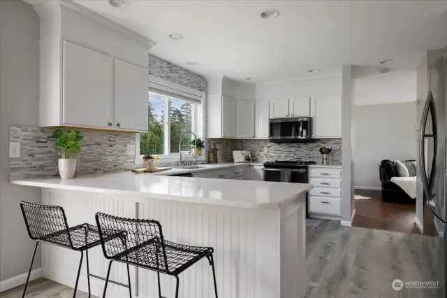 This charming breakfast bar is great for meal prep - but it also creates a great space for guests and family to gather, chat, and enjoy each other's company while you whip up meals or for those cozy early mornings when you just need a quick bite and a good conversation.