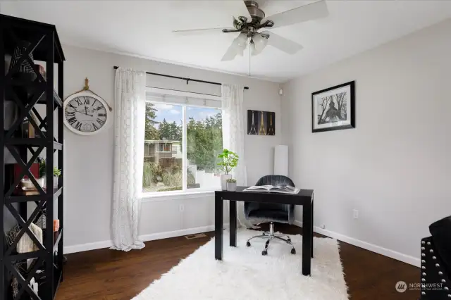 Office nook is seamlessly integrated into the corner of the living room, offering a sweet spot to work without sacrificing the home's open feel.