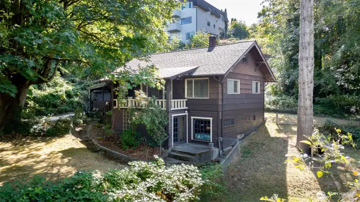 On the side of the house you’ll find a fully fenced area, giving pets plenty of room to safely explore and play. Just beneath the covered front porch is a doorway that takes you straight into the full basement, a versatile space that can serve as a workshop for projects, a spot for hobbies, or simply a place to keep everything organized and out of the way.