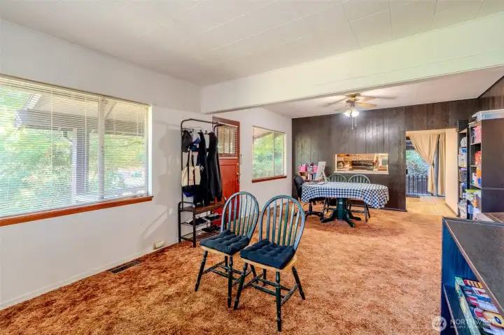 A classic touch from the home’s era, the dining area includes a pass-through window to the kitchen. It adds convenience for serving and a sense of connection between the spaces, while also reflecting the character of the home’s original design.