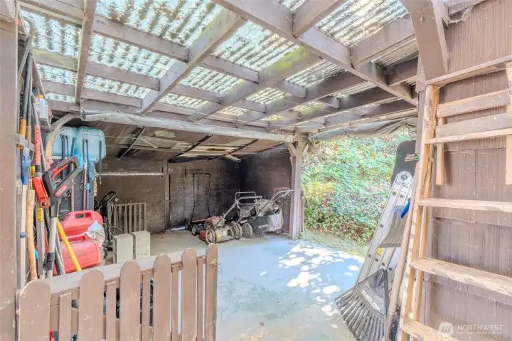 This home continues to surprise with useful spaces, including a covered lean-to along the side. It’s the perfect spot to keep yard tools, outdoor gear, or anything you want protected yet easy to access. A practical feature that adds to the home’s everyday function.